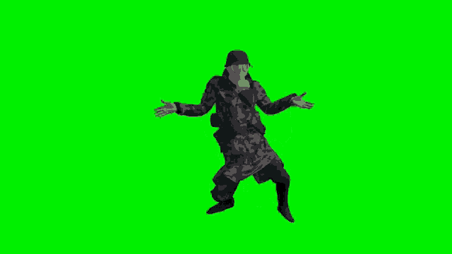 a soldier wearing a gas mask and a helmet is dancing on a green screen .