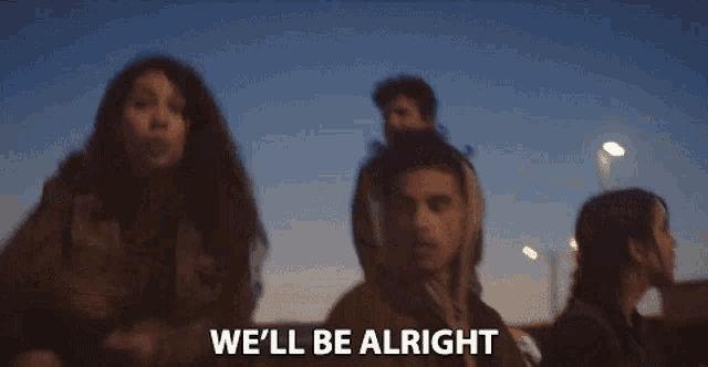 a group of people standing next to each other with the words `` we 'll be alright '' written on the bottom of the image