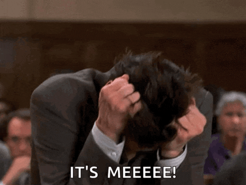 a man in a suit and tie scratches his head and says it 's meeeee