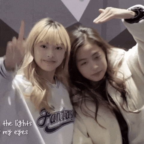two girls are posing for a picture with the words the lights in my eyes behind them
