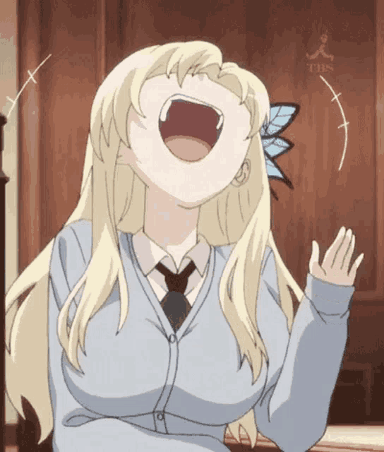 a blonde anime girl is laughing with her mouth open and a tbs logo in the background