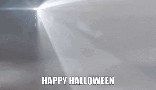 a monster with red eyes and the words happy halloween