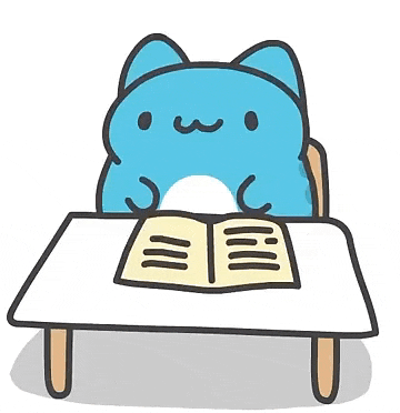 a blue cat is sitting at a table with a book .
