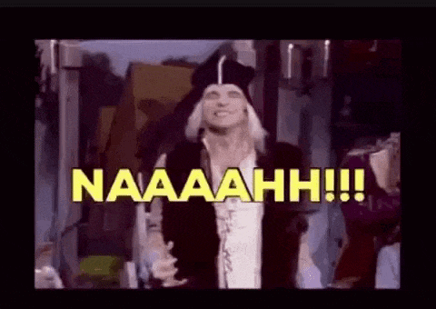 a man in a pirate costume is standing in front of a crowd and says naaaahhh !!! .