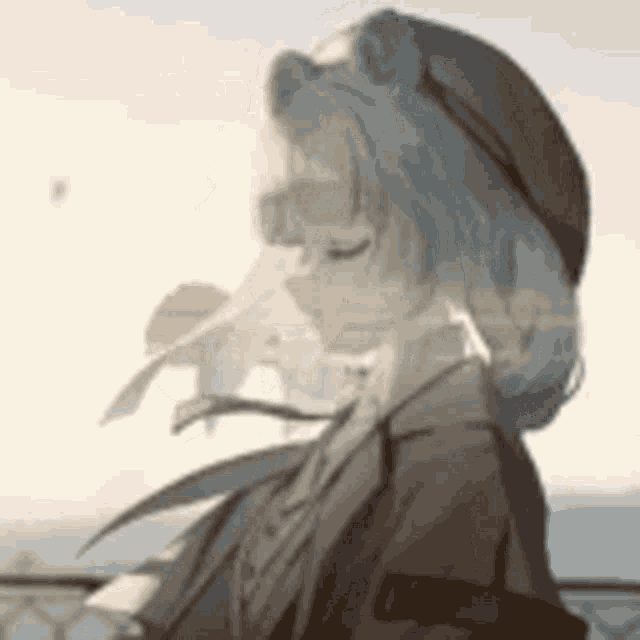 a close up of a person wearing a hat and sunglasses .