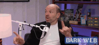 a man sitting in front of a microphone with the words dark web on the bottom right
