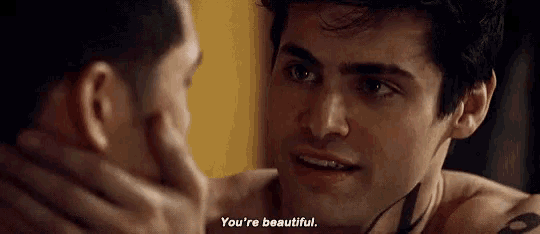 two men are looking at each other and one of them is saying `` you 're beautiful . ''