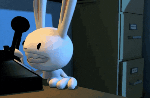 a cartoon rabbit is sitting on a desk next to a filing cabinet with a label on it that says " sammy "