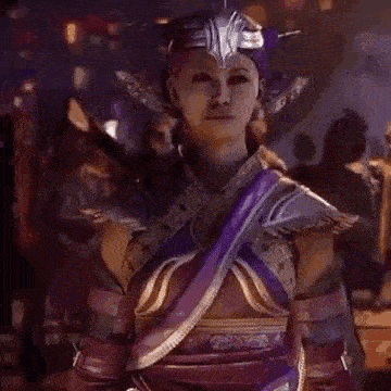 a woman in a purple and gold costume is standing in front of a crowd .
