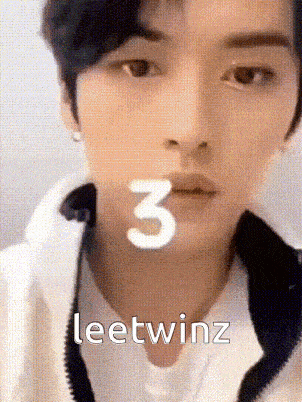 a close up of a person 's face with the number 3 on it