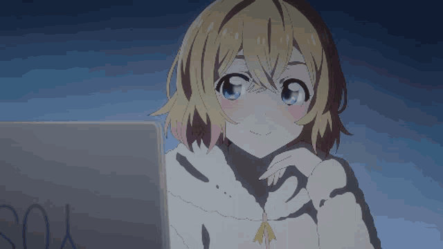 a girl is sitting in front of a laptop with the word you written on it