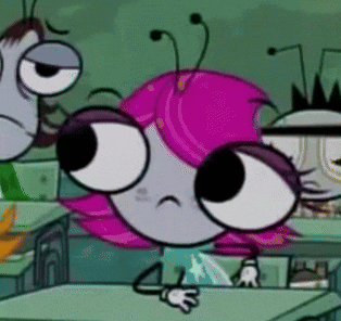 a cartoon character with pink hair and big eyes is sitting at a desk