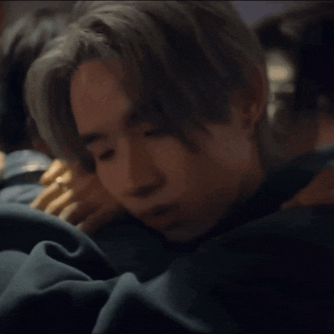 a man with a ring on his finger is sleeping