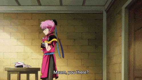 a girl with pink hair is standing in front of a brick wall and says " maaam you there "