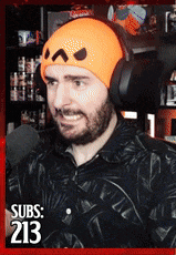 a man wearing headphones and an orange beanie with the number 213 on it