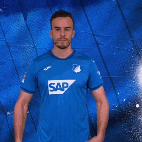 a man in a blue shirt with sap on the front