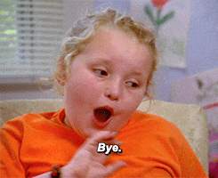 a girl in an orange shirt says bye