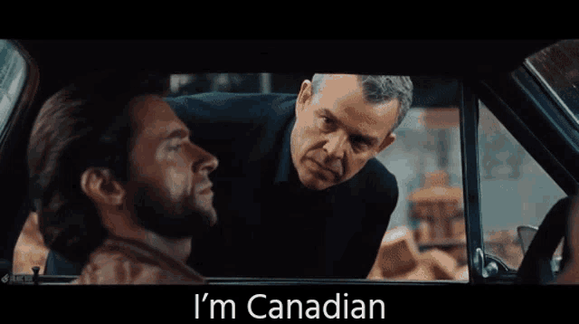 a man in a car says i 'm canadian in front of another man