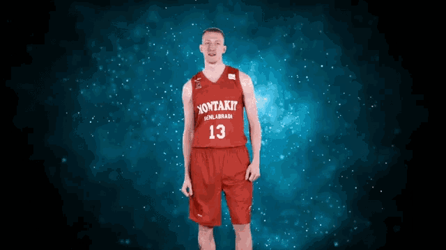 a man wearing a red jersey with the number 13