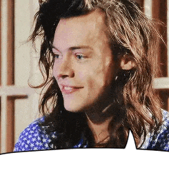 a man with long hair is smiling with a speech bubble behind him