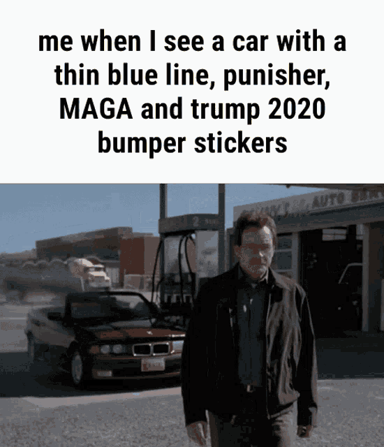 a man standing in front of a car with a thin blue line punisher maga and trump 2020 bumper stickers on it
