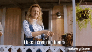 a woman is standing on a porch with a caption that says i been cryin for hours .