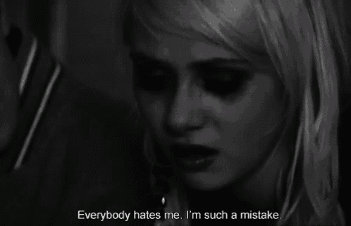 a woman crying with the words everybody hates me i 'm such a mistake below her