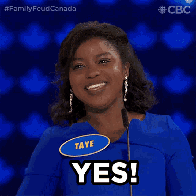 a woman with a name tag that says taye on it says yes
