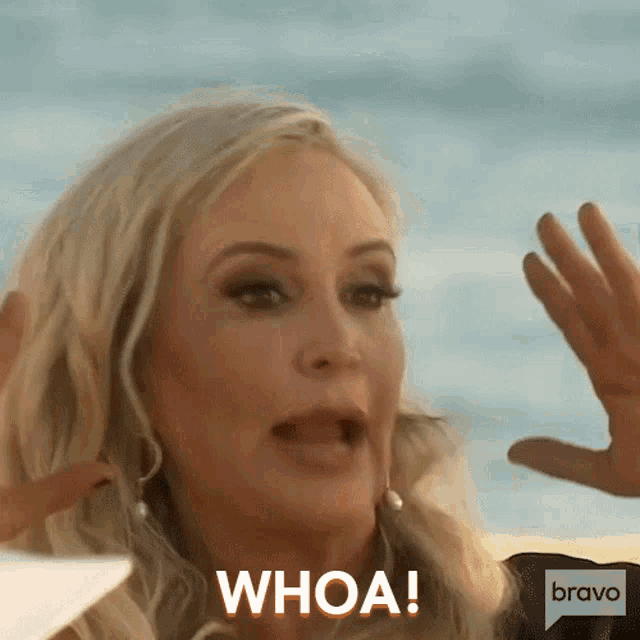 a woman is making a funny face and saying whoa bravo