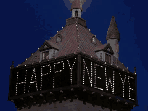a sign on the side of a building that says happy new year