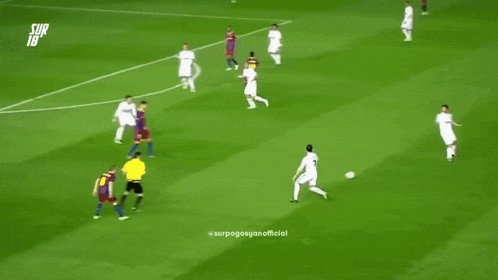 a group of soccer players are playing on a field with the number 18 on the sidelines