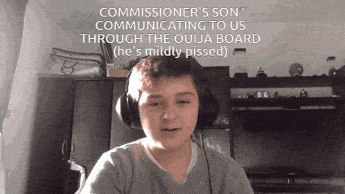 a boy wearing headphones with the caption " commissioner 's son "