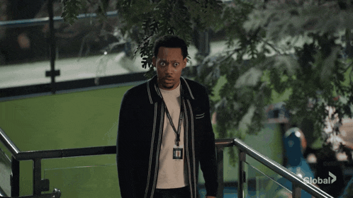 a man wearing a lanyard with a badge that says ' global ' on it