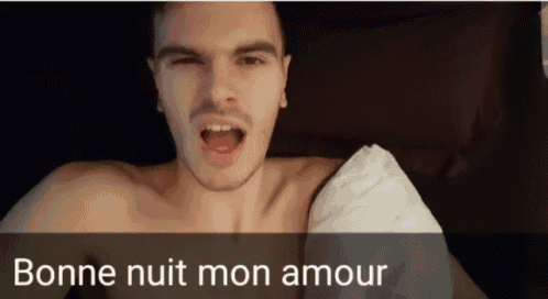 a shirtless man is laying in bed with the words bonne nuit mon amour written below him