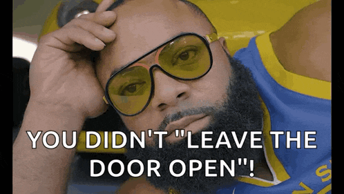 a man wearing sunglasses and a golden state warriors jersey says " you didn 't " leave the door open "