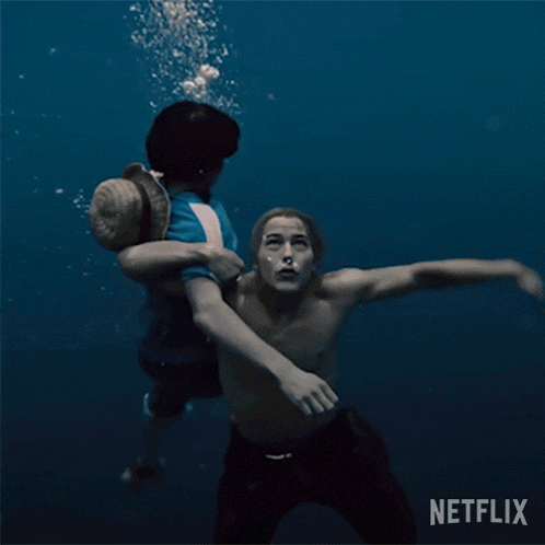 a man is holding another man underwater with a netflix logo in the background