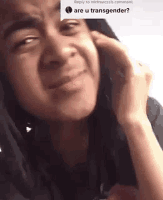a close up of a person talking on a cell phone .