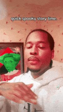 a man says quick spooky story time in front of a painting
