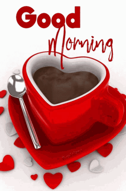 a red heart shaped cup of coffee with a spoon and the words good morning