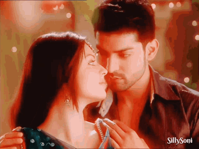 a picture of a man and woman kissing with silly soni written on the bottom right