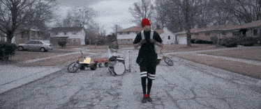 a man stands in front of a drum set that says twenty one pilots on it