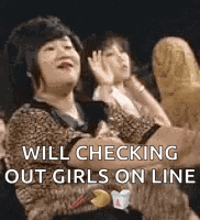 a woman in a leopard print shirt is sitting in a crowd of people and making a funny face .