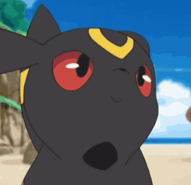 a close up of a pokemon with red eyes and a yellow crescent moon on its head .