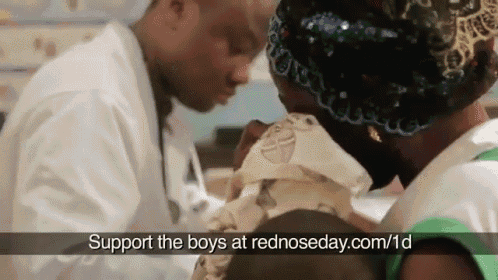 a woman kisses a baby while a doctor looks on in a support the boys at rednosedayday.com/1d ad