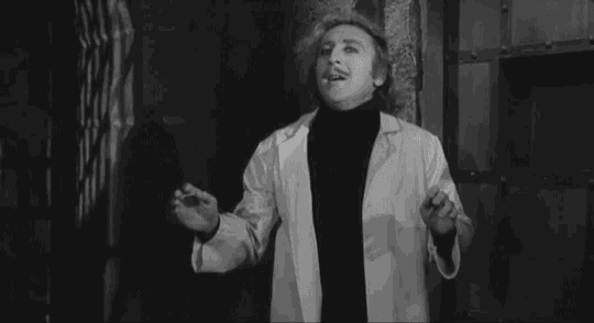 a man in a white coat says hello handsome in a black and white photo