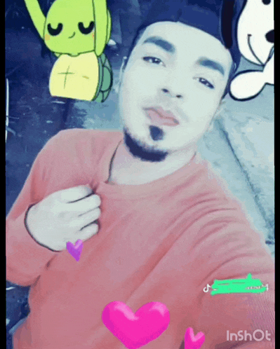 a man in a red shirt is taking a selfie with a turtle and a dog