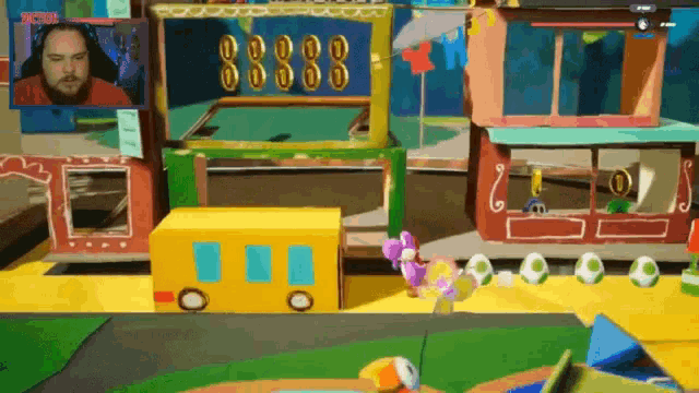 a man is playing a video game with the number 888 on the screen