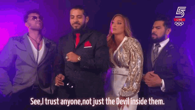a group of people standing next to each other with the words " see i trust anyone not just the devil inside them " on the screen