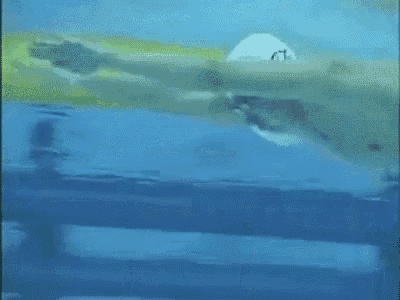a person is swimming in a pool with a yellow tube in the water