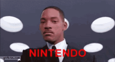 a man in a suit and tie is looking through binoculars with the word nintendo on the bottom